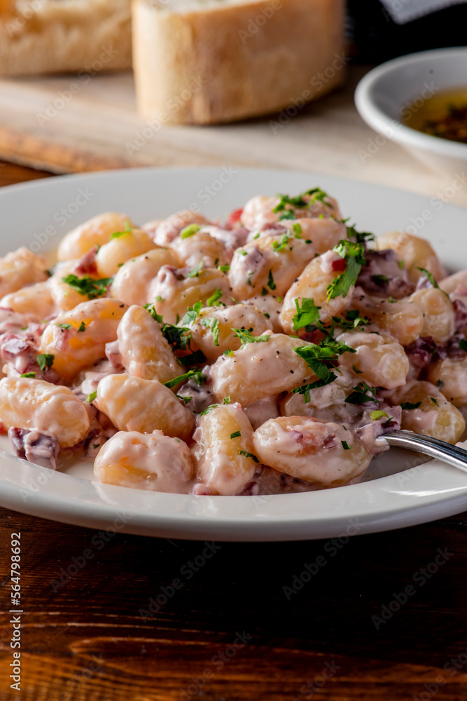 Gnocchi. Pasta sautéed with truffles garlic, onions, olive oil and fresh herbs and spices. Classic American steakhouse or French bistro appetizer or side dish. Gnocchi. Pasta sautéed with truffles garlic, onions, olive oil and fresh herbs and spices. Classic American steakhouse or French bistro appetizer or side dish.