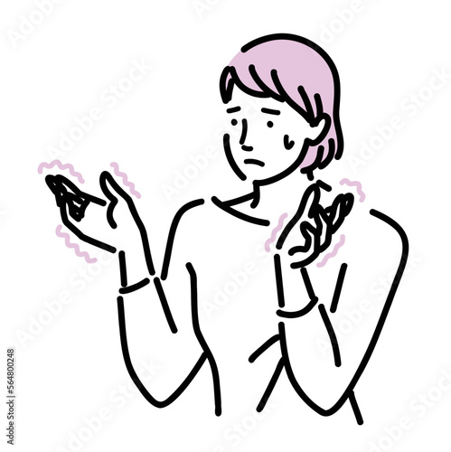 手の痺れに悩んでいる女性
