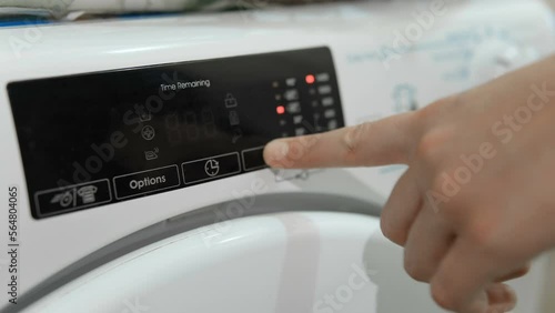 Wife woman use touch screen washing machine for clothes cleaning home routine,energy costs saving. 4k