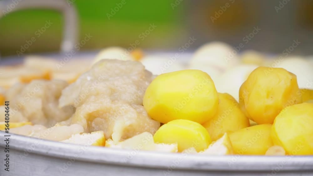 Potatoes, Tofu and Eggs steaming in a steam pot.Street food named Siomay in Indonesia Potatoes, Tofu and Eggs steaming in a steam pot.Street food named Siomay in Indonesia