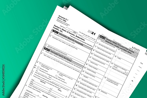 Form 1065 (Schedule K-1) documentation published IRS USA 11.17.2021. American tax document on colored