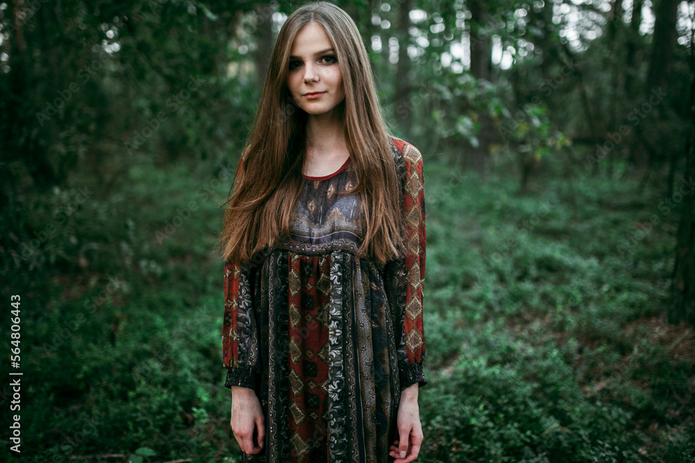 girl stands in the forest in a long dress girl stands in the forest in a long dress