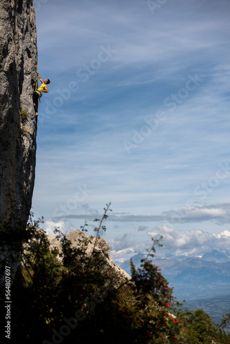 Men climbing a sport route on limestone in Ceuse, France. photo