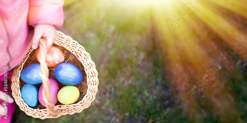 Canvas Print child collects colorful Easter eggs in basket