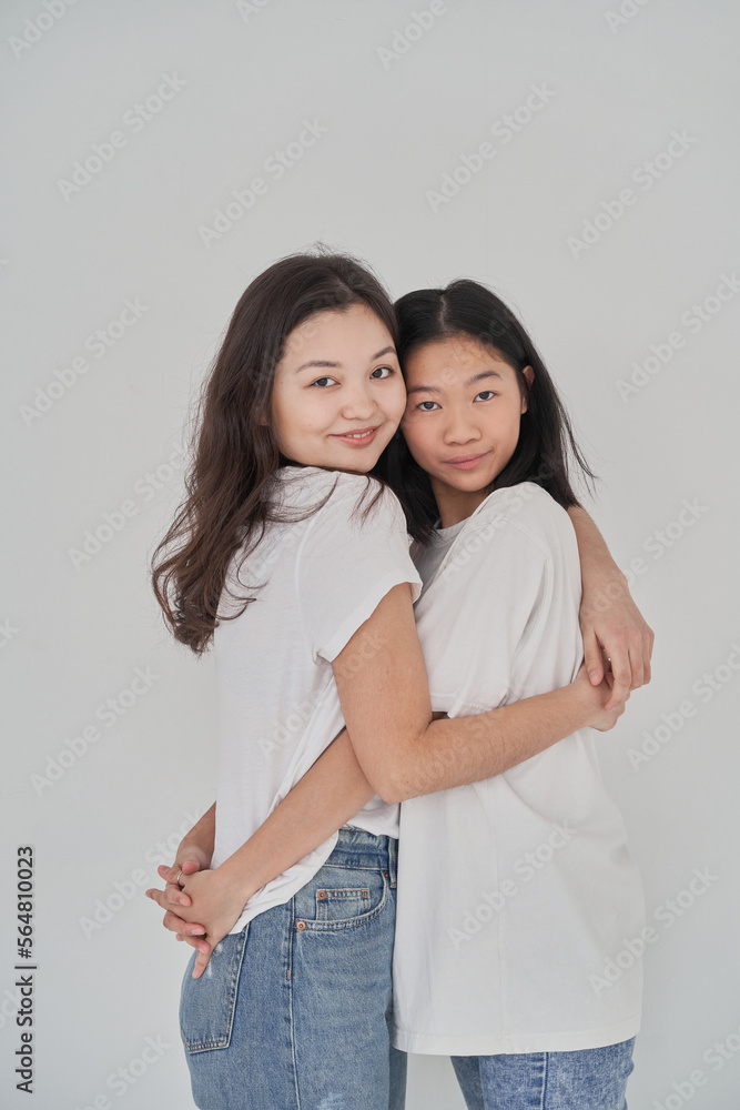 Young Asian women hugging each other Young Asian women hugging each other