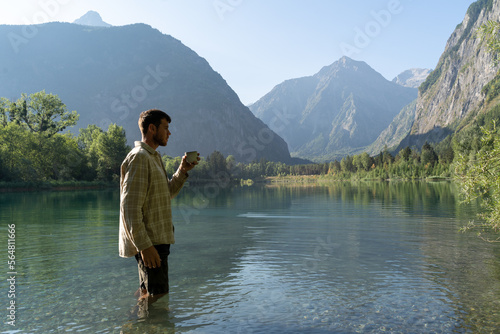 Man drinking coffee in nature photo