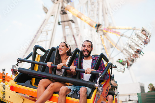 Excited couple on amusement ride