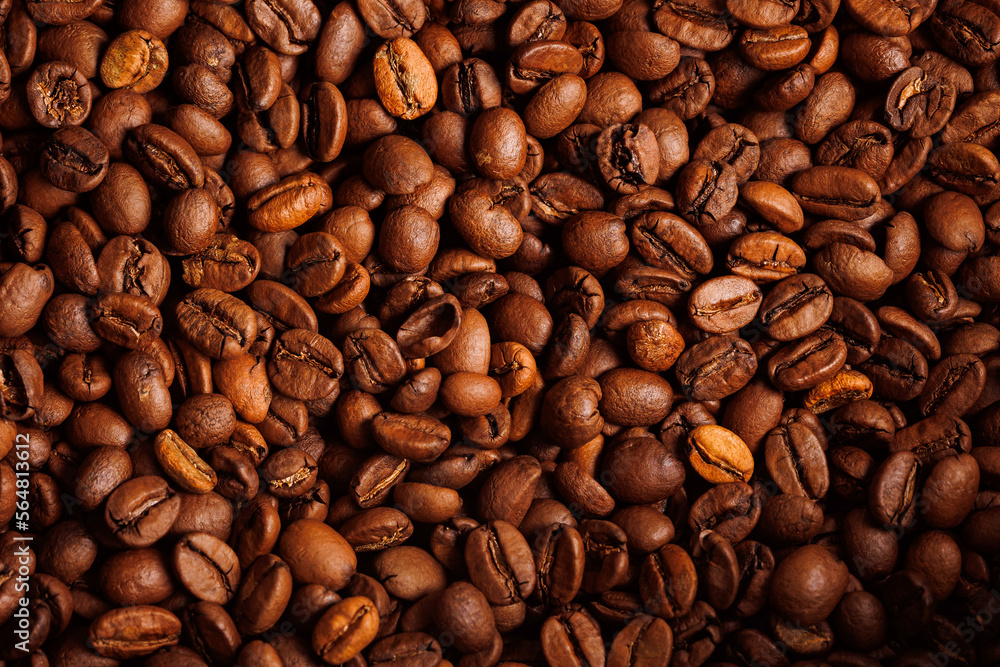 Fototapeta premium Macro background of fresh roasted brown coffee beans