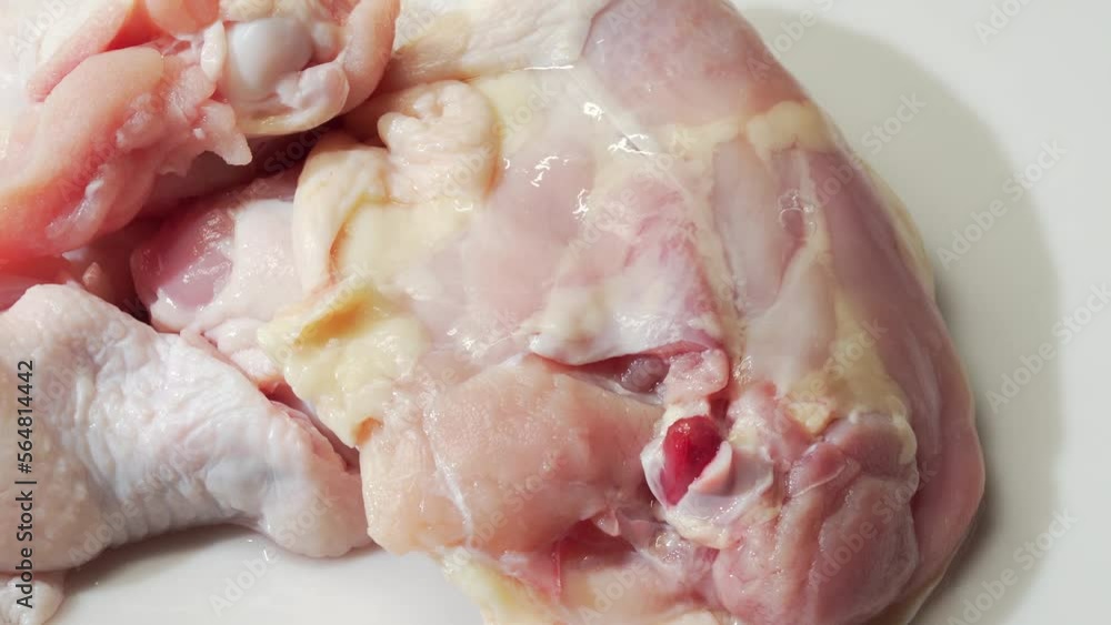 Fresh chicken thighs on white background Fresh chicken thighs on white background