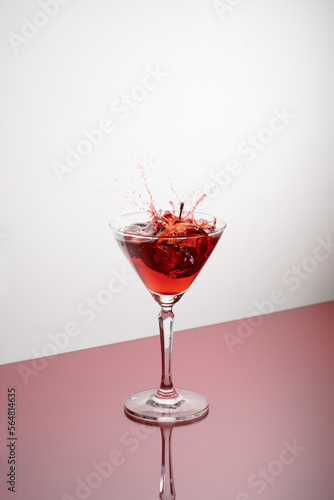 glasses of cherry brandy liqueur with ripe berries photo