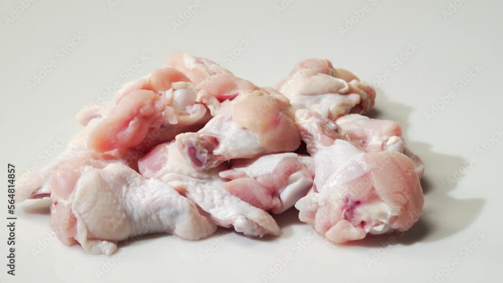 Fresh chicken thighs on white background Fresh chicken thighs on white background