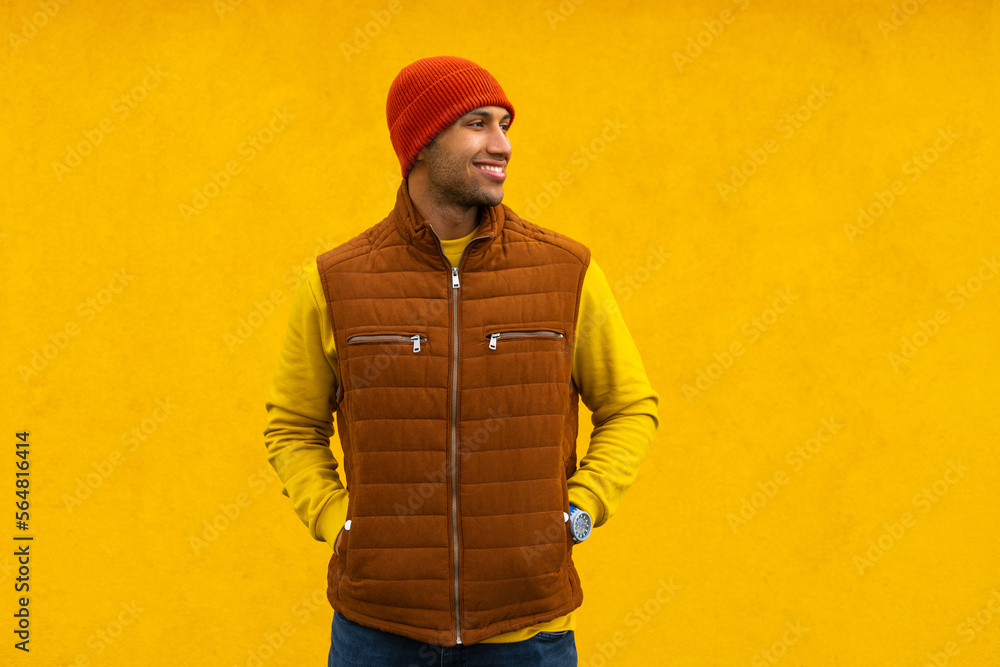 man in autumn clothes on a yellow background man in autumn clothes on a yellow background