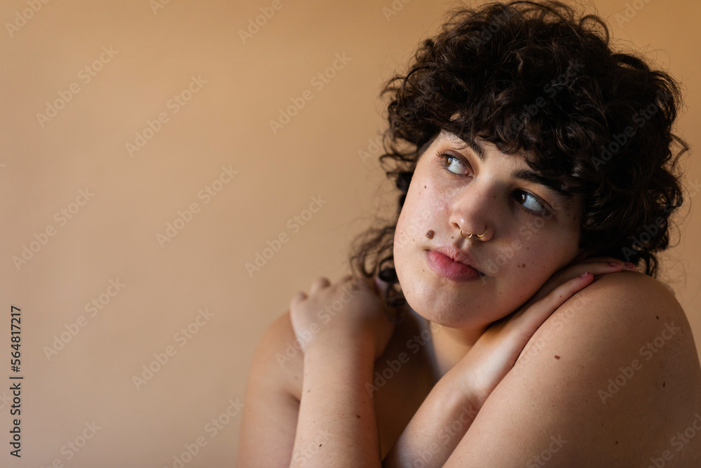 Short curly haired woman nude portrait Short curly haired woman nude portrait