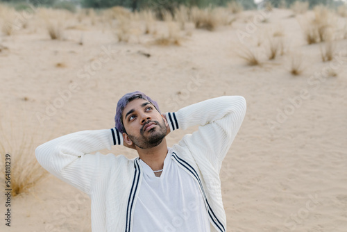 A melancholic man on the chair in the desert