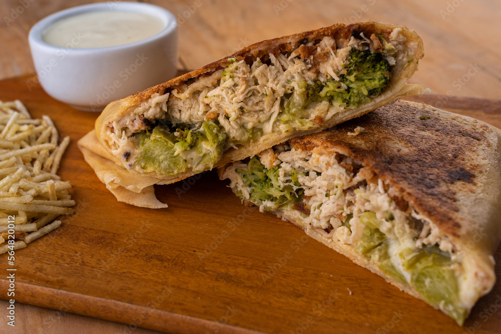 Swiss crepe stuffed with chicken and broccoli, béchamel sauce and potato sticks Swiss crepe stuffed with chicken and broccoli, béchamel sauce and potato sticks