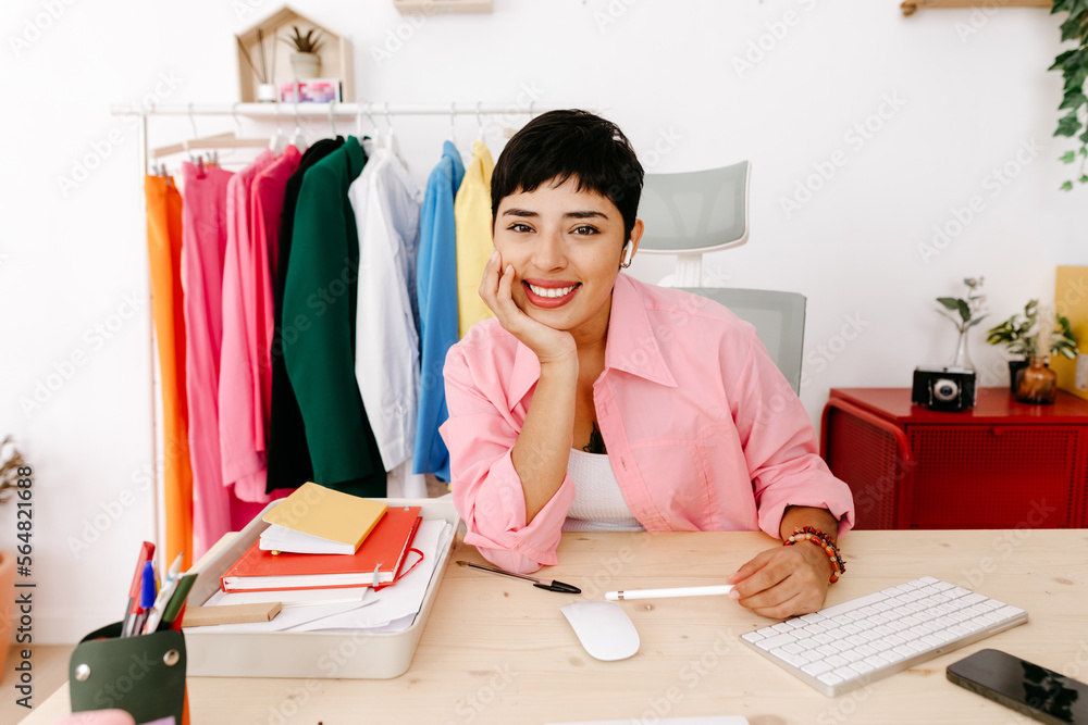 Glad Latin American businesswoman looking at camera Glad Latin American businesswoman looking at camera