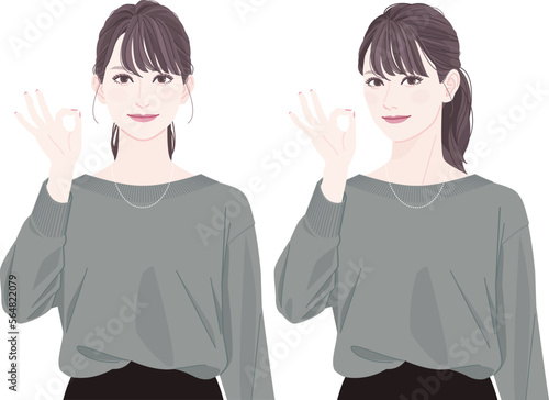 A woman with a ponytail giving an OK hand sign.