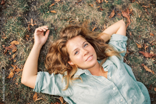 redhead woman in a park