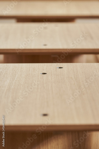 Perspective of wooden tables in the modern cafe