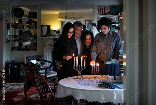 Hanukkah: Family Gathers To Light Two Menorahs photo