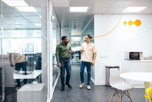 Coworkers chatting in the office