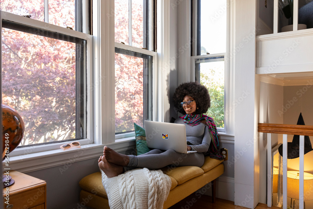 African American Lifestyle Girl relaxing at home with laptop computer African American Lifestyle Girl relaxing at home with laptop computer