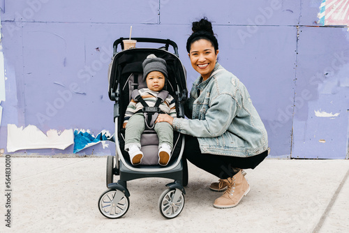 A mother and her baby in a stroller