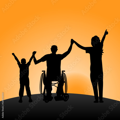 Silhouette of a disabled man in a wheelchair with his arms raised next to a child and a woman at sunset. Happy family concept