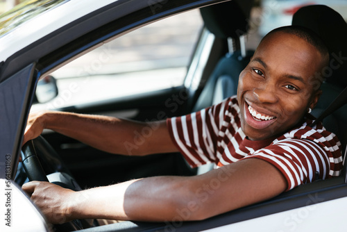 Happy man driving car photo