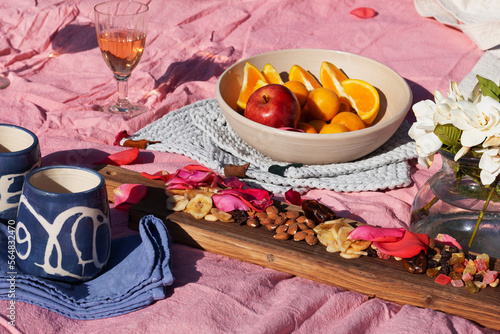 Picnic set with fruit, cheese, toast, honey, wine photo