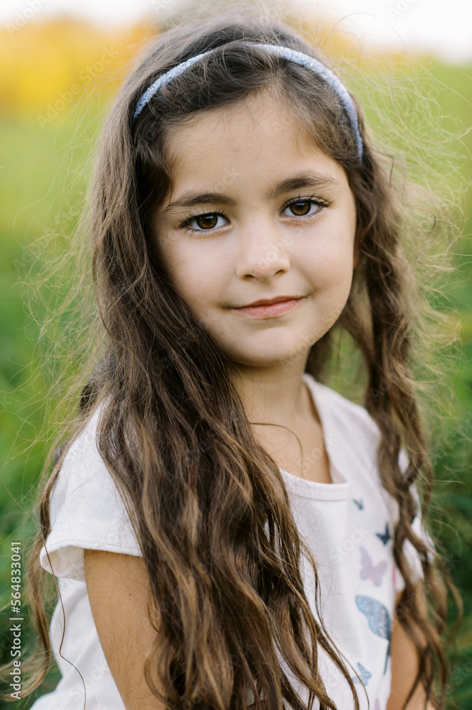 close up portrait of a brunette toddler girl outdoors close up portrait of a brunette toddler girl outdoors