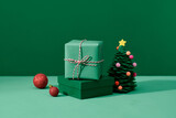 Green gift box and decorated New Year Tree on the background.