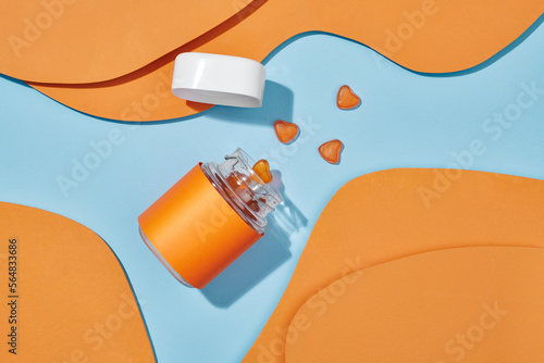 jelly candy or multivitamins closeup on the table on blue background