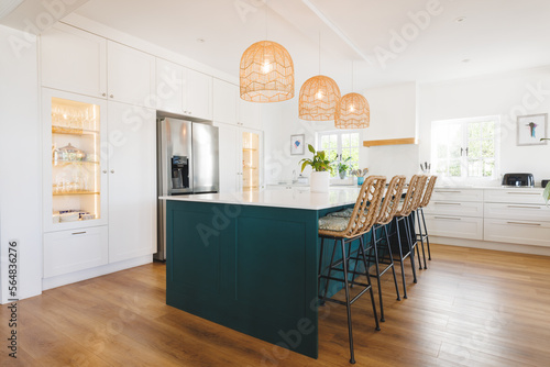 General view of luxury kitchen with countertop and kitchen equipment photo