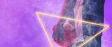 Midsection of african american basketball player with ball and glowing triangle on purple background