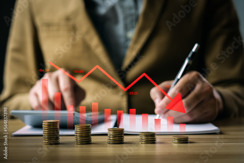 Economic crisis concept, businessman with falling financial graph chart due to global recession. Stock market crash, inflation, financial crisis, Falling income in GDP, capital reduction