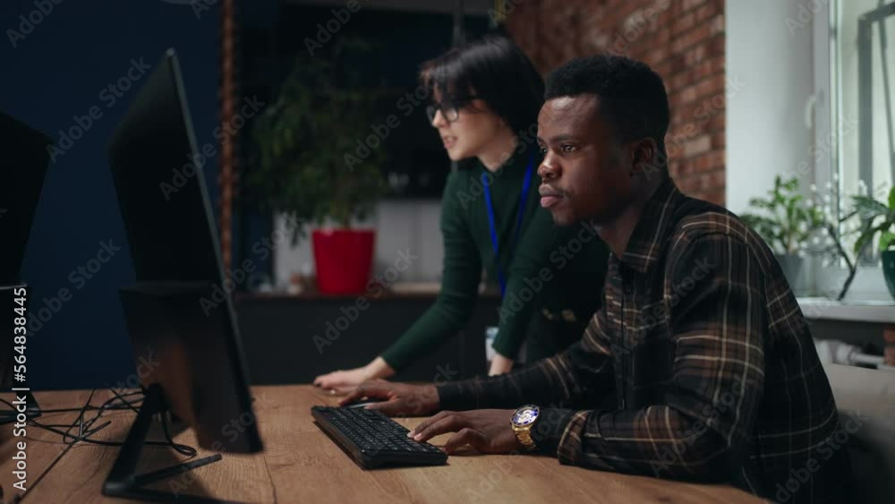 black IT specialist and female caucasian engineer creating 3D model project in office, teamwork black IT specialist and female caucasian engineer creating 3D model project in office, teamwork