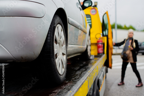 Woman and tow truck