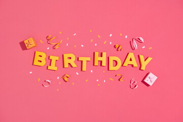 Happy birthday paper letters on a festive background w