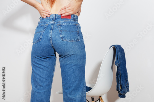 Close up of front of woman wearing denim jeans photo