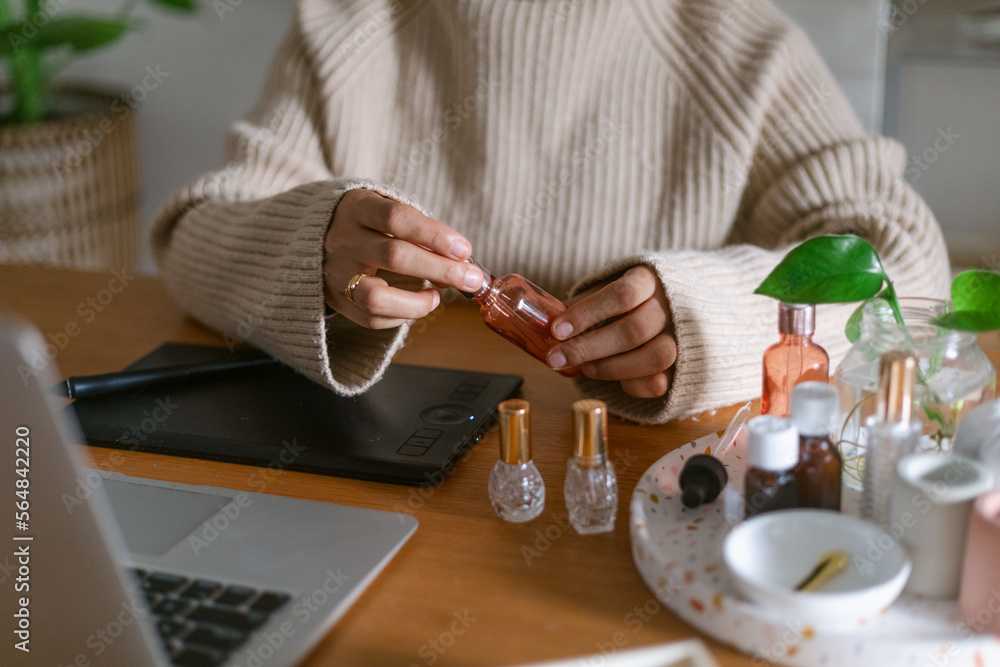 Perfumer creating homemade scents at desk Perfumer creating homemade scents at desk