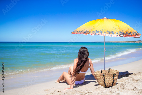 Young beautiful woman on the beach vacation enjoy summer day