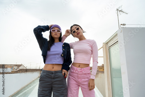 Two asian female friends addicted to social media  photo