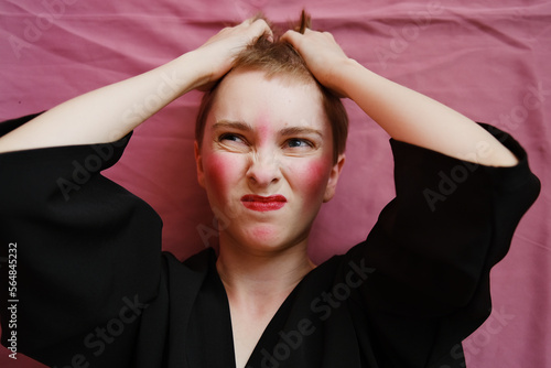 Portrait of girl with red makeup in studio