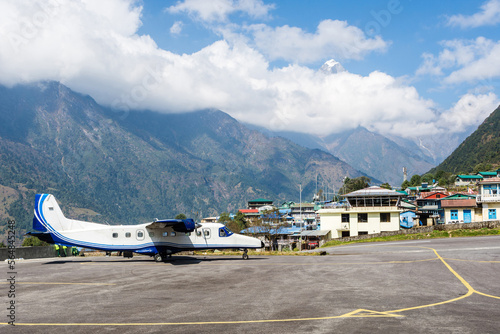 Twin turboprop airplane in Tenzing-Hillary Lukla airport, Lukla, Nepal photo