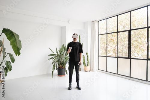 Man Playing Videogames In VR photo
