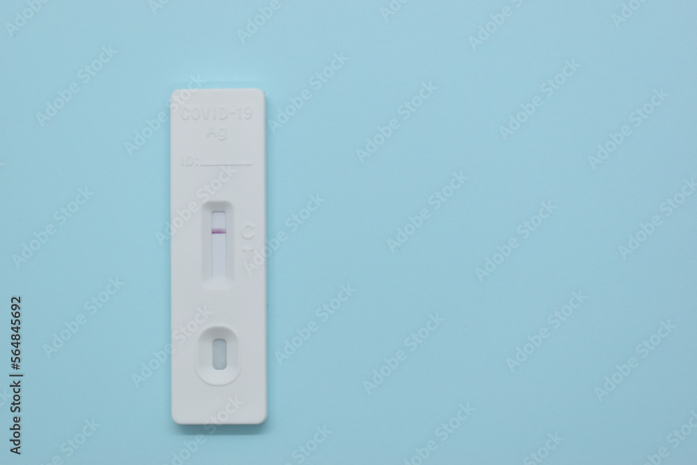 covid test kit on blue background covid test kit on blue background