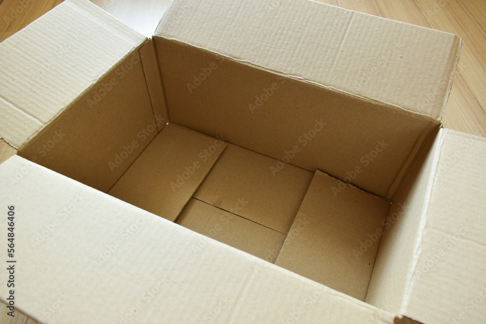 brown post box packaging put on wood floor brown post box packaging put on wood floor
