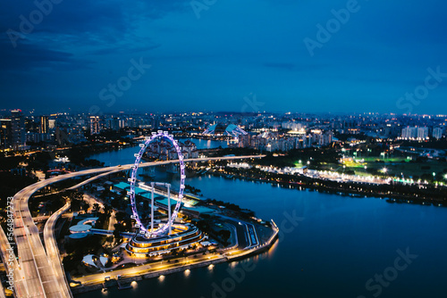 City lights in Southeast Asia from above river flowing to ocean
