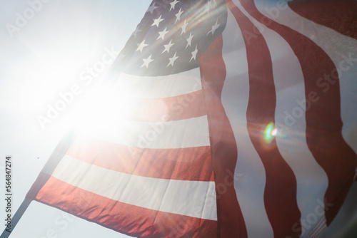 Sunflare with American flag in summer sunshine